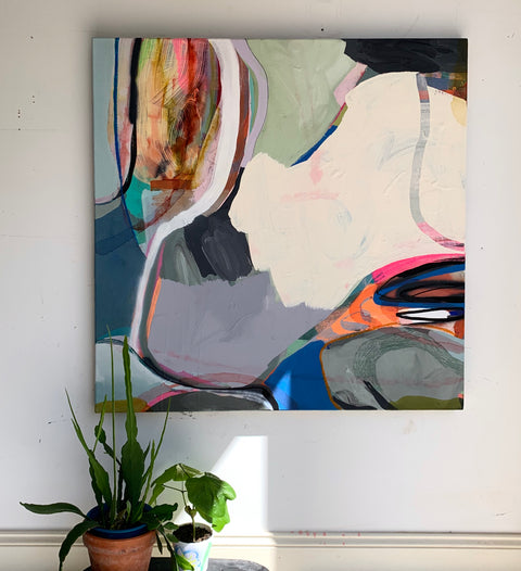 Abstract painting on canvas of organic shapes and curved lines mounted on the wall
