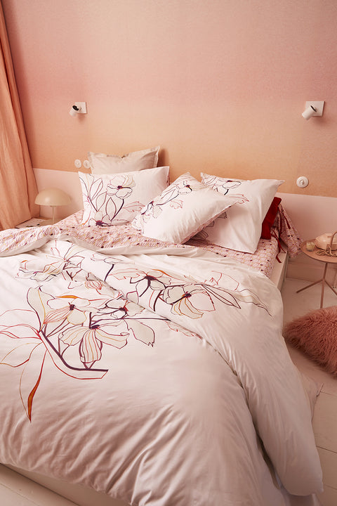 Blush bedding set featuring bold floral designs by Eva